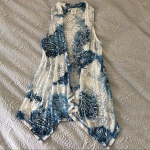 Blue and white sleeveless cardigan.
